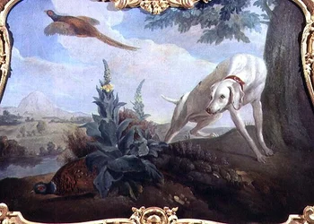 Hund med vilt i ett landskap