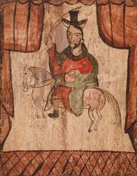 Figur som rider på en häst