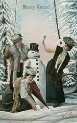 Viktorianska kvinnor som leker med snögubbe