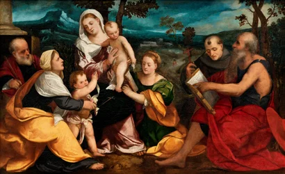 Den heliga familjen omgiven av helgon, ca 1530 (olja på pannå)
