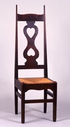 Stol designad av C.F.A. Voysey (1857-1941) 1898, troligen tillverkad av C.H.B. Quennell (1872-1935) (ek)