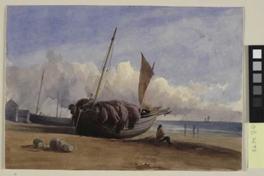 Strandad fiskebåt med sittande fiskare