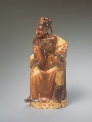 En figur av Guandi sittande, 1300-1400-tal (snidat elfenben)