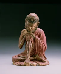 Röd lackfigur av Sakyamuni, grundaren av den buddhistiska tron, som dyker upp från bergen, Yan-dynastin, 1280-1368 (trä och förgylld)