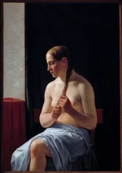 Sittande nakenmodell. Porträtt av en kvinna som flätar hennes hår (fläta). Målning av Christoffer Wilhelm Eckersberg (1783-1853)