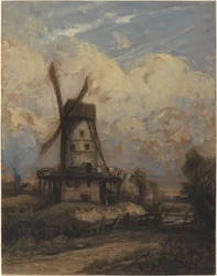 En väderkvarn mot en molnig himmel