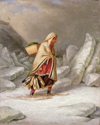 En indisk kvinna som bär snöskor