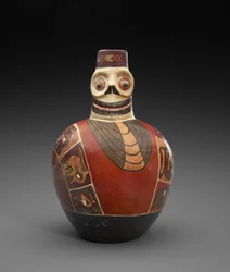 Figurflaska med dödsmask, 600-1000 AD (lergods med slip)