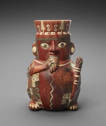 Figurburk med pannrör och klubba, ca. 600-1000 AD (lergods med slip)