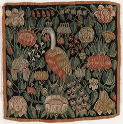 Gobeläng kuddfodral föreställande fågel bland blommor, tillverkat i Schleswig-Holstein, Danmark, ca 1690 (ull)