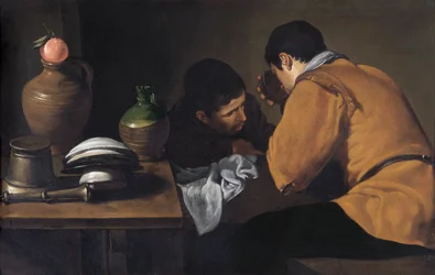 Två unga män äter vid ett enkelt bord ca 1618-20 (olja på duk)