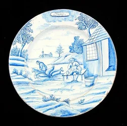 Tallrik från Delftware med juni månad (tennglaserat lergods)