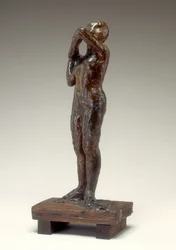 Dansare som justerar axelremmen på sitt liv, 1880-1890-talet.
