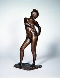 Dansare som knyter ihop sina strumpbyxor, ca 1885-90, gjuten 1919 (brons)