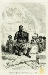 Stamledaren Ketimkuru spelar dragspel. Gravyr av Riou som illustration till berättelsen "Sjöarna i Ekvatorialafrika" av Victor Giraud, marinens fänrik, från 1883-1885, i Le Tour du monde, 1886, under ledning av Édouard Charton (1807-1890), Hachette