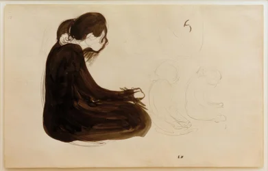 Kvinna sitter
