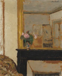 Vas med blommor på en mantel