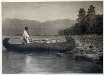 Indians of America: en indian på en kanotbåt i södra Flathead Lake, Montana