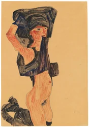Knästående flicka som drar sin kjol över huvudet, 1910.