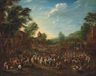 En kermesse i en by med dansande och glada människor
