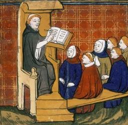 Dominikansk lärare, sittande med bok placerad på en talarstol, med elever på marken framför sig. ""Livre des Proprietes des Choses"", tidigt 1400-tal.