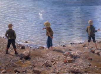Tre pojkar på stranden
