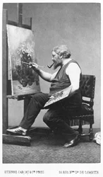 Gustave Courbet målar vid sitt staffli (foto)