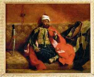 Turk fumant, assis sur un divan - Turk, röker på en divan ...