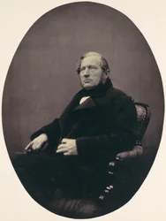 [Man sitter i fåtölj], 1850-60-tal.