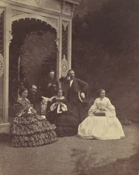 [Porträtt av tre kvinnor och män i en trädgård], 1850-60-tal.