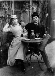 Par på terrassen på ett café och dricker absint - fotografi, cirka 1890