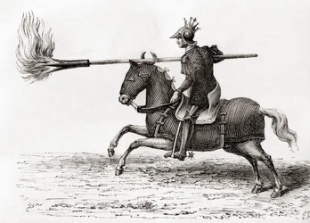 En medeltida riddare som bär en eldlans, eller eldspjut, ett av de första krutvapnen i världen, från Les Merveilles de la Science, publicerad ca 1870 (gravyr)