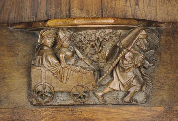 Snideri föreställande ett par i en vagn dragen av en man, från en körbås (trä)