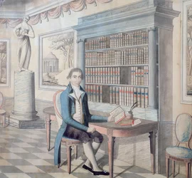 Gentleman läser i sitt bibliotek