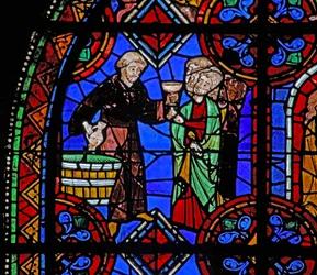 Fönster w06 som visar pilgrimer vid graven till St Julian av Brioude där vin distribueras
