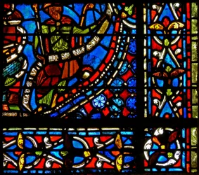 Fönster w9 som visar farao som håller en banderole med orden I Clement of Chartres gjorde detta fönster (i Joseph-fönstret)