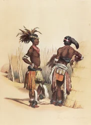 Två unga Zulu-män, klädda i livfulla traditionella kläder
