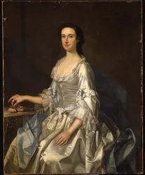 Mary, fru till Henry, 7:e Lord Arundell av Wardour, i en grå satinklänning, med rosor vid ett bord