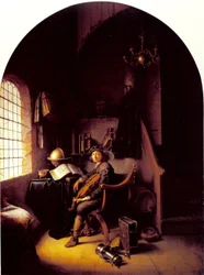 Ung violinist sitter i sitt arbetsrum