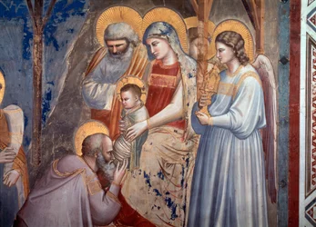 Tillbedjan av Magi. Detalj som visar magikern som lutar sig framför Jesus i Marias armar mellan ängeln och Saint Joseph (fresko
