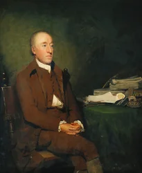 Porträtt av Dr James Hutton, sittande tre fjärdedels längd i en brun jacka och ridbyxor och vit stock, en hög med geologiska exemplar på bordet bredvid honom,