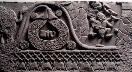 Byggande av en grotta (relief på Baruth-stupan)
