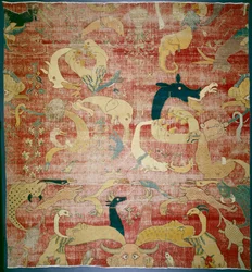 Del av en matta med fantastiska djur på röd mark, Mughal, c.158085 (bomulls- och ullhög)