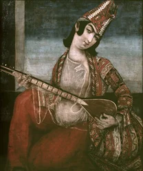 Ung kvinna som spelar gitarr