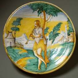 Flöjtspelare i ett landskap. Keramiskt fat tillverkat i Viterbo, Italien. Slutet av 1500-talet, Florens, Museo Nazionale del Bargello