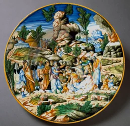 Mose låter vatten strömma ur klippan och ger Israels folk att dricka. Keramiskt fat tillverkat i Urbino i Fontana-verkstaden, Italien. Omkring 1560, Florens, Museo Nazionale del Bargello