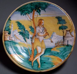Renässanskonst: tallrik dekorerad med en flöjtspelare (En flöjtspelare) - Slutet av 1500-talet. Tillverkad i Viterbo (Viterbo), Italien. Florens, Museo Nazionale del Bargello