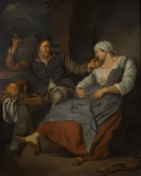 Ett sittande par som dricker vin