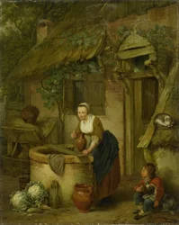 Kvinna som drar vatten från en brunn