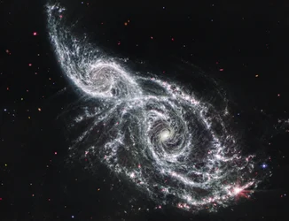 Galaxerna IC 2163 och NGC 2207 (MIRI-bild)